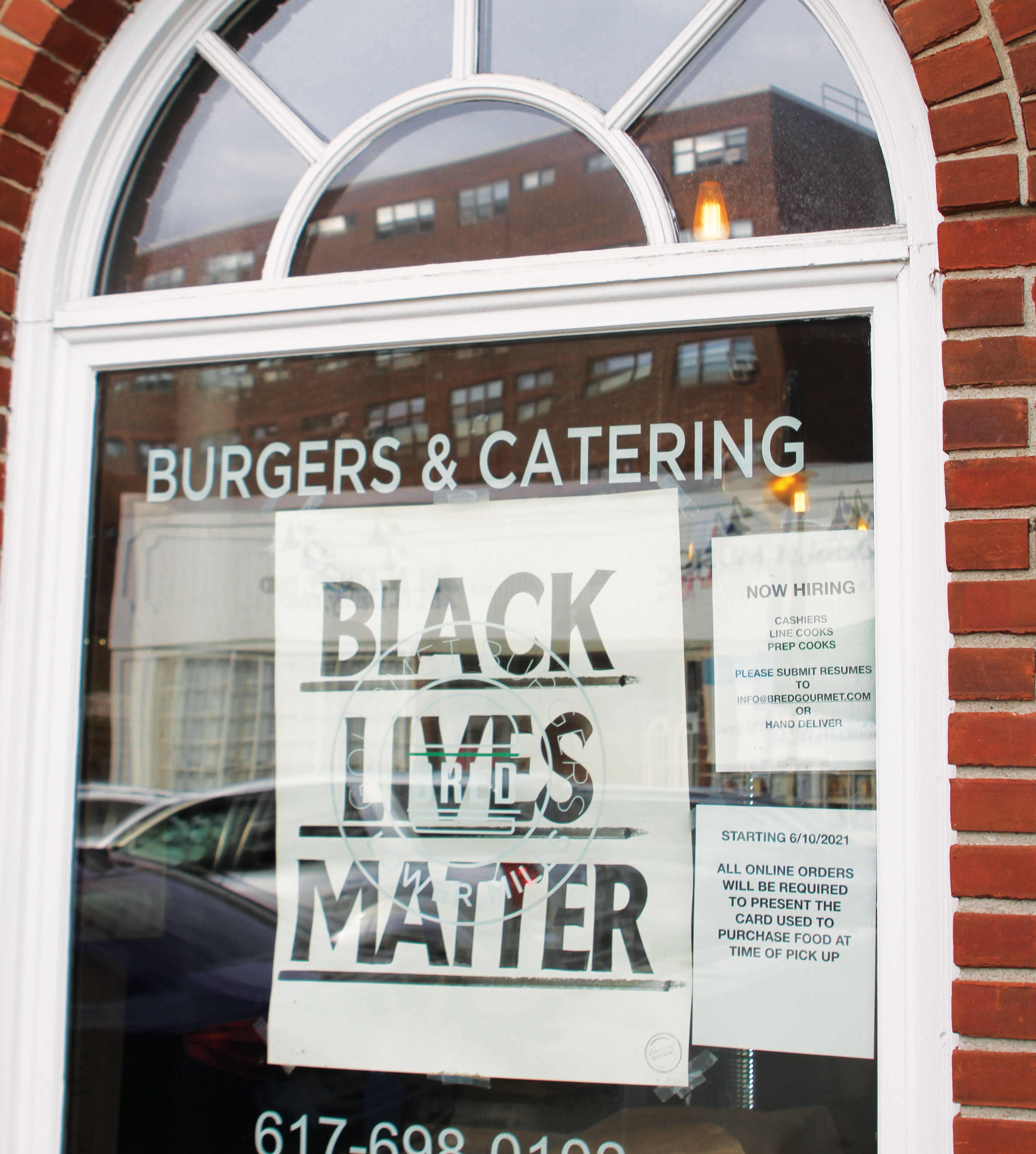 Black Lives Matter sign hanging from Bred Gourmet's window.